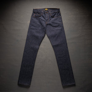 Pair of dark blue jeans on a gray background